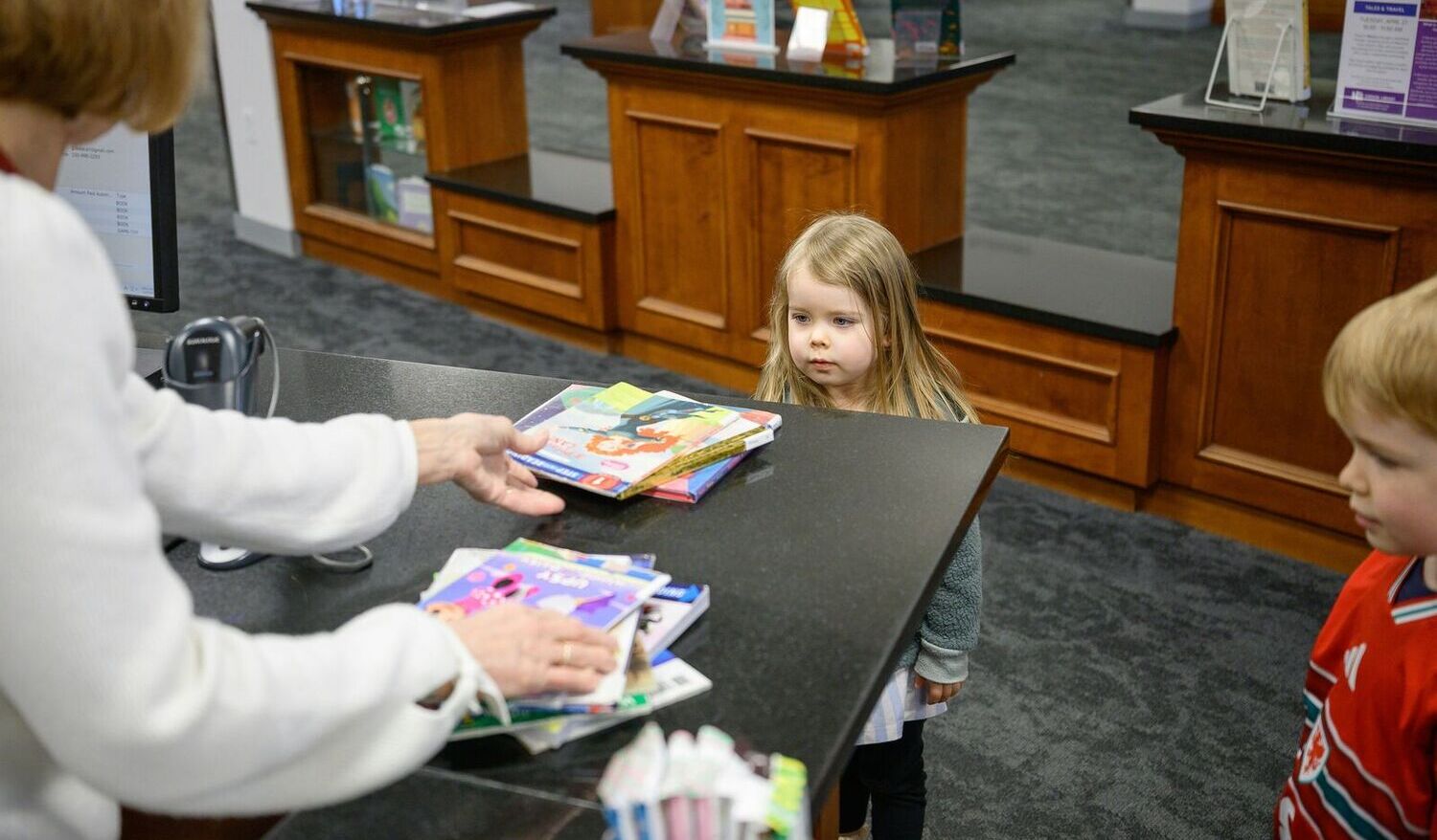 child borrowing books