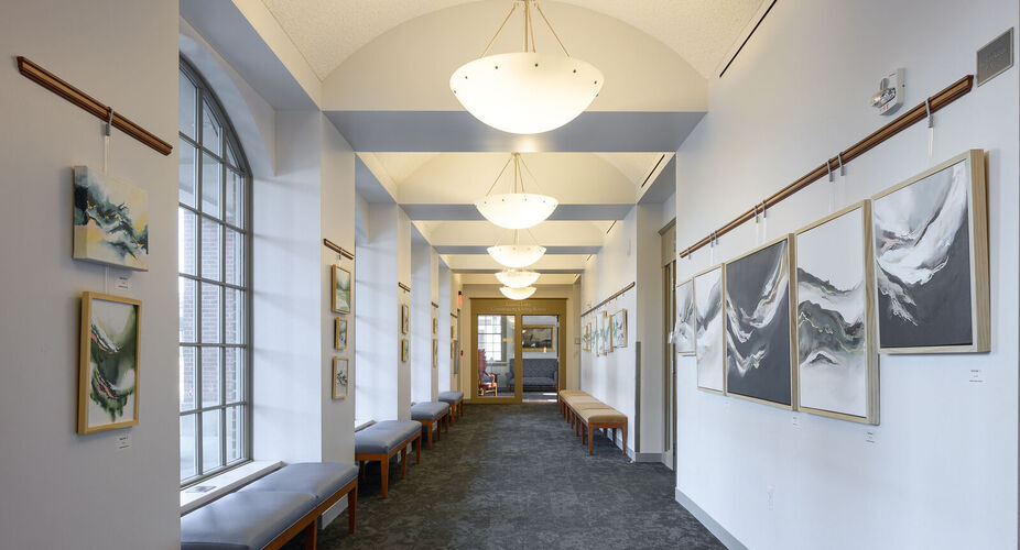 Art gallery hallway, art visible on either side