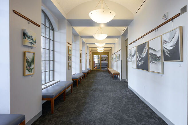 Hallway with art hanging on either side