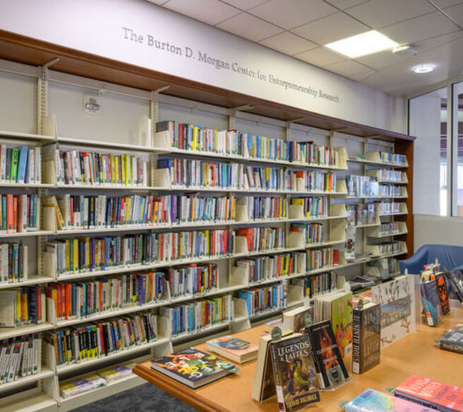 Bookshelf with sign overhead reading, 'The Burton D. Morgan Center for Entrepreneurship Research'